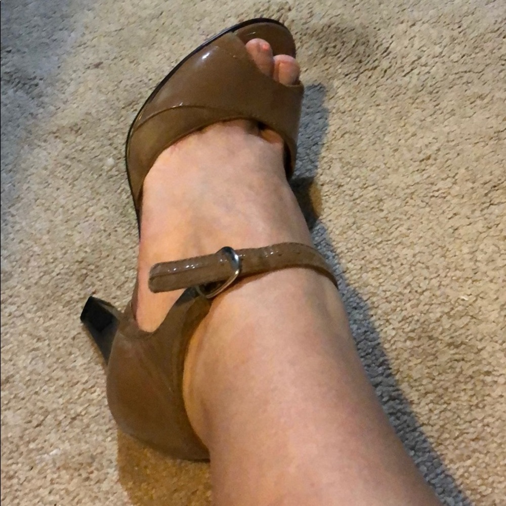 Woman’s tan high heels
